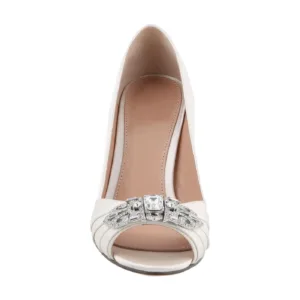 Close-up view of white bridal shoes with rhinestone embellishment, perfect for weddings by Lajwanti Collections.