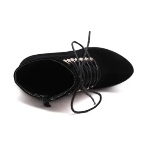Close-up of high heel ankle boots by Lajwanti Shoes with gold grommets and lace-up design.