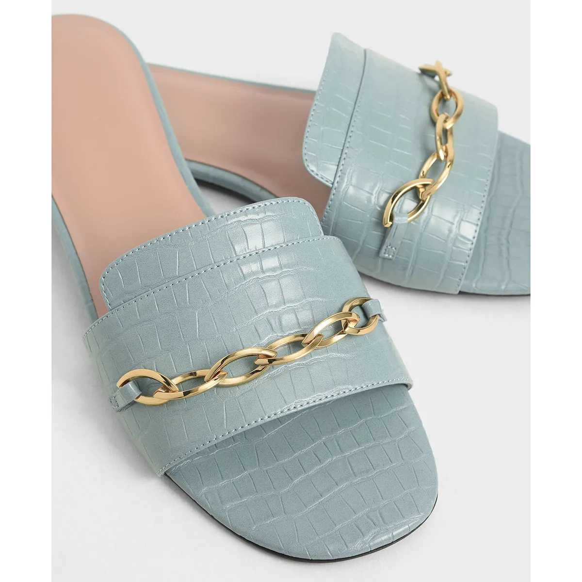 Close-up of Light Blue Flat Shoes with Gold Chain by Lajwanti Designers close-up of light blue flat shoes with gold chain from Lajwanti Designers