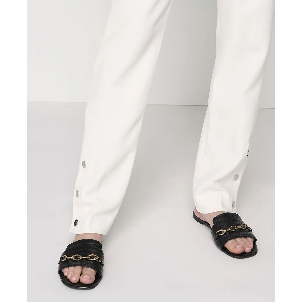 Black Custom Flat Shoes with Gold Chain by Lajwanti Designers – Worn by Model black custom flat shoes with gold chain worn by model from Lajwanti Designers