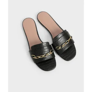 close-up of black custom flat shoes with gold chain from Lajwanti Designers