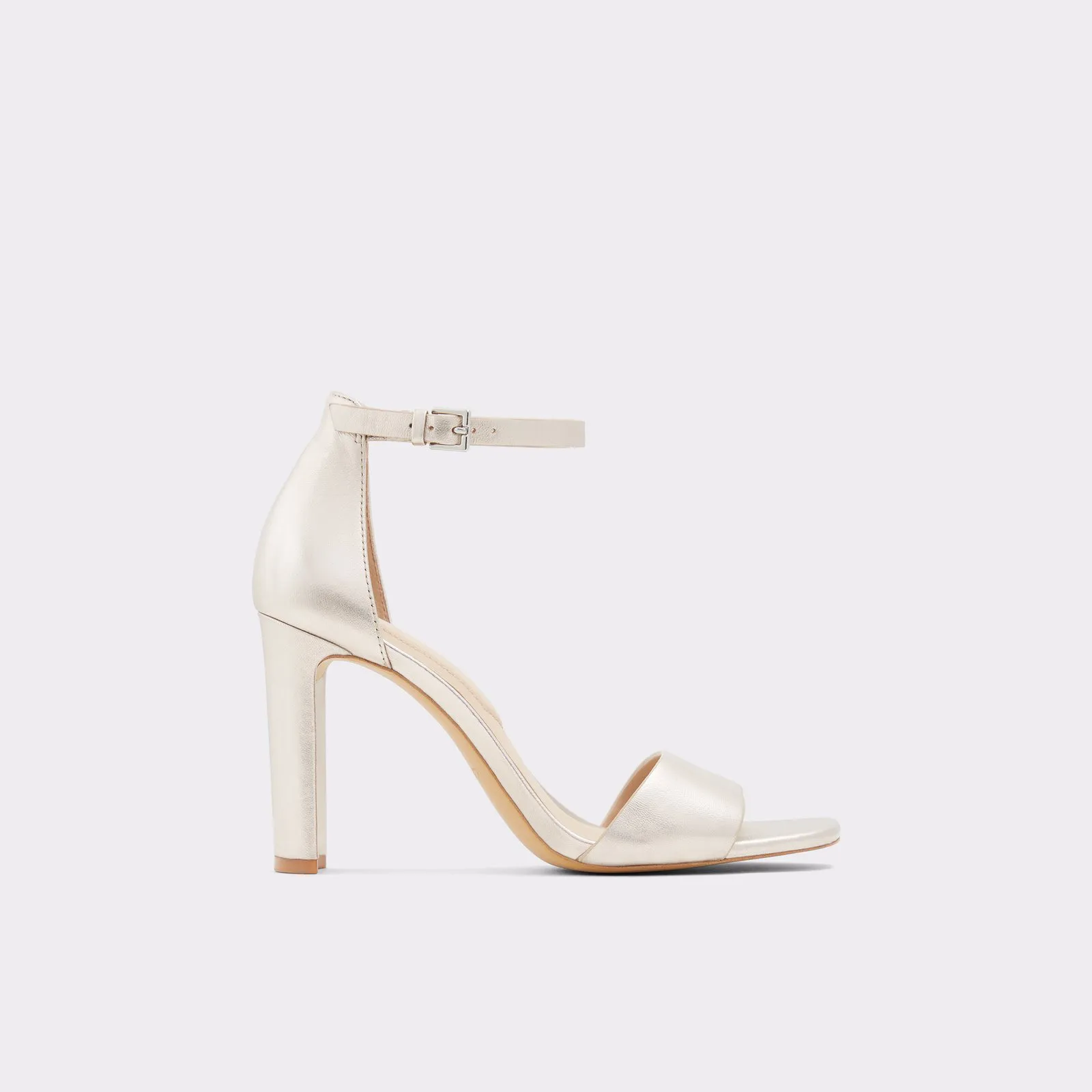 Ivory High Heels Lajwanti Shoes Side view of Lajwanti’s ivory high heels with an ankle strap and block heel.