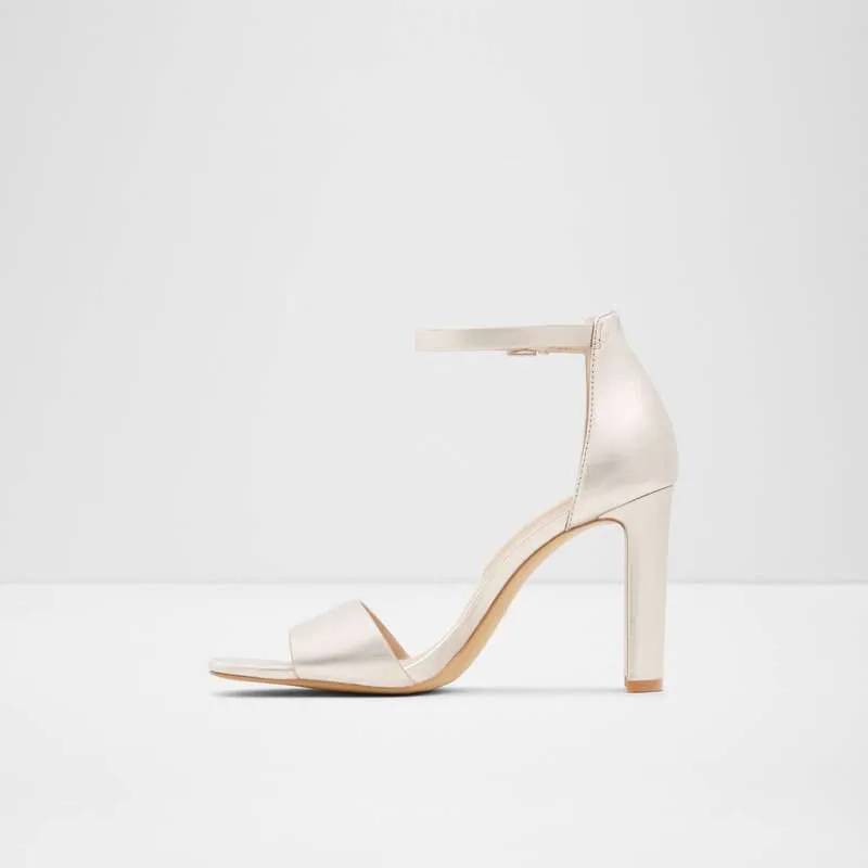 High Heels Ivory Lajwanti Shoes Ivory high heels by Lajwanti Shoes with buckle strap and block heel design.
