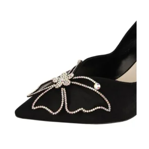 Close-up view of rhinestone butterfly on black wedding shoes – Elegant bridal footwear by Lajwanti Official.