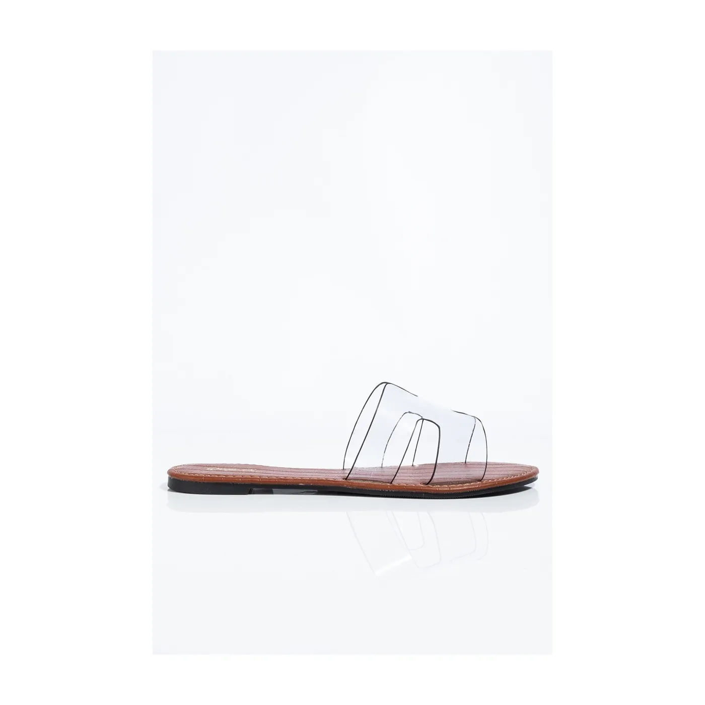 Side View of Clear Flat Shoes – Comfortable Transparent Strap Sandals Side view of clear flat shoes by Lajwanti Designers with simple and chic design.