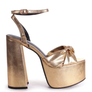 gold platform shoes with knot design by Lajwanti Designers