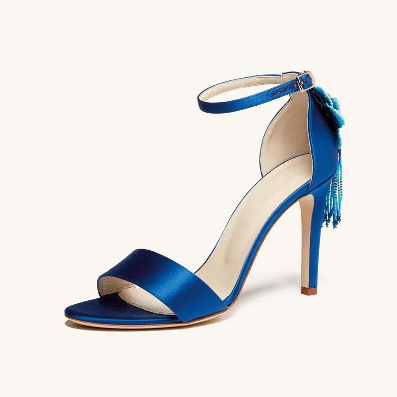 Blue Satin Sandals with Floral Detail and High Heels Blue satin sandals with ankle strap and blue floral detail on the back.