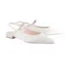 white flat wedding shoes from Lajwanti Designers with elegant silver strap