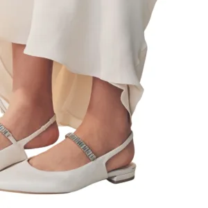 close-up view of white flat wedding shoes from Lajwanti Designers, showing silver strap