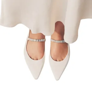 white flat wedding shoes from Lajwanti Designers with silver strap, worn by bride