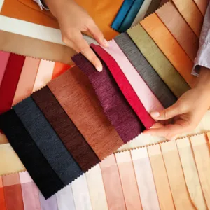 A collection of fabric swatches in various colors for bespoke shoe design, showcasing the customization process.
